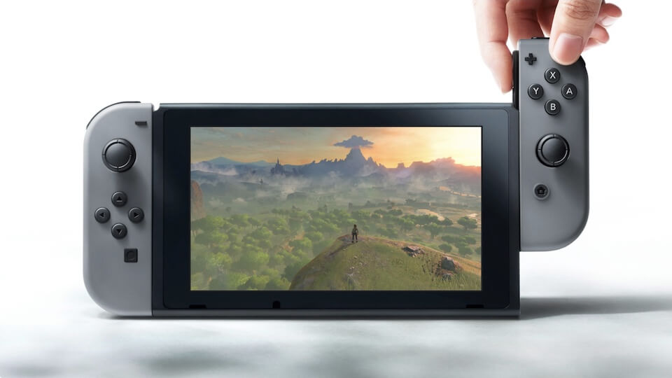 Bild av nya spelkonsolen Nintendo Switch där ena kontrollen avlägsnas från höger sida av bildskärmen